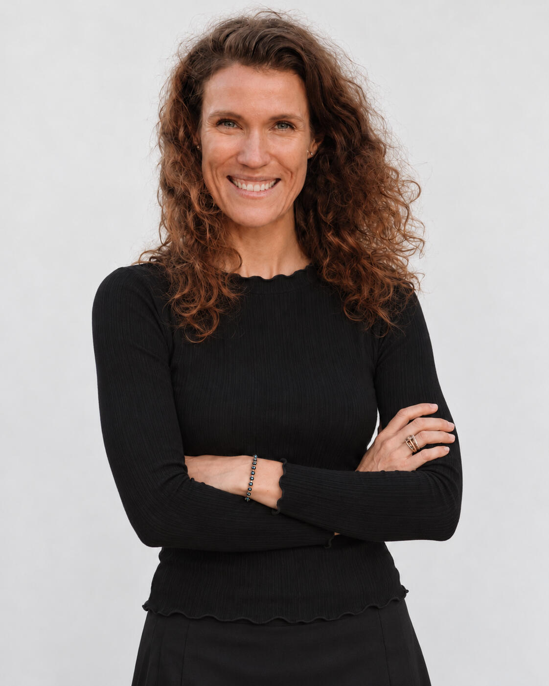Portrait of Simone Schweiger wearing a black long-sleeved top.